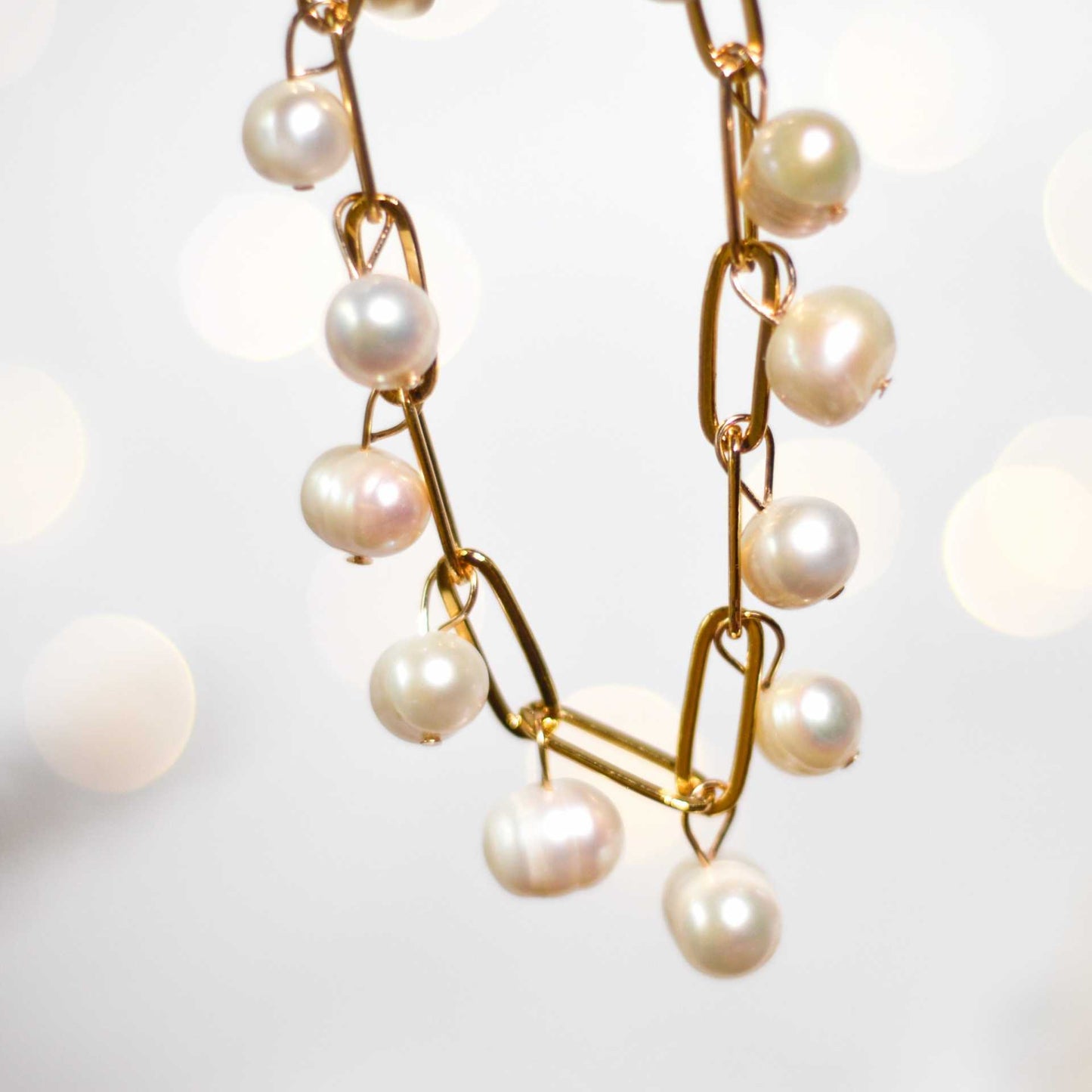 10-pc. White semi-round pearls yellow gold plated bracelet