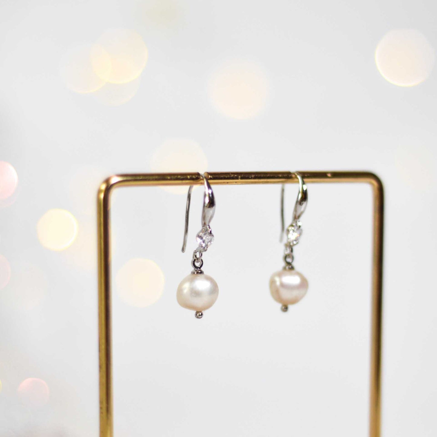 8.3 mm white kieshe pearl dangling rhodium plated with zircon earrings