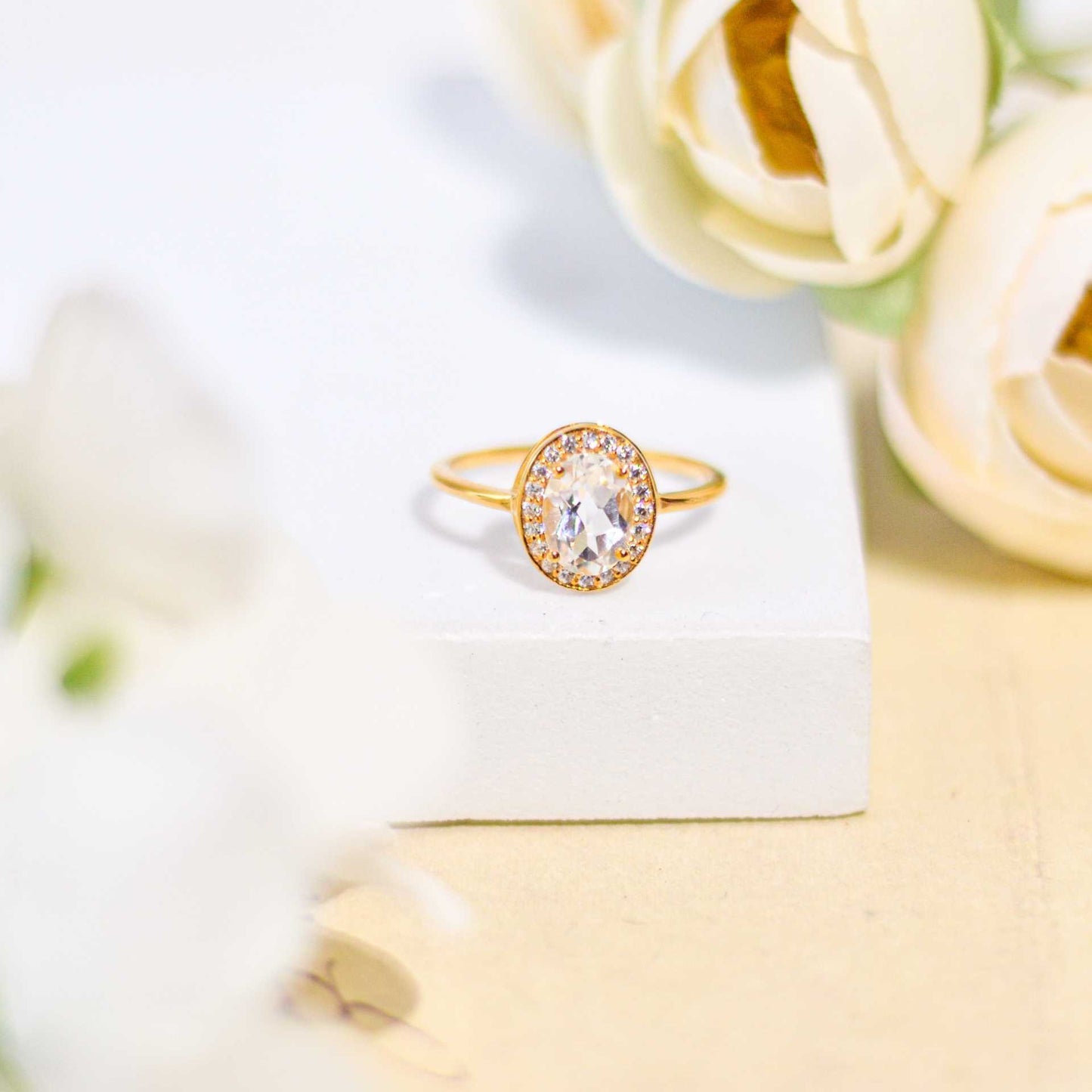 8 x 6 mm Oval cut White Topaz with Cz Halo Yellow gold plated Ring