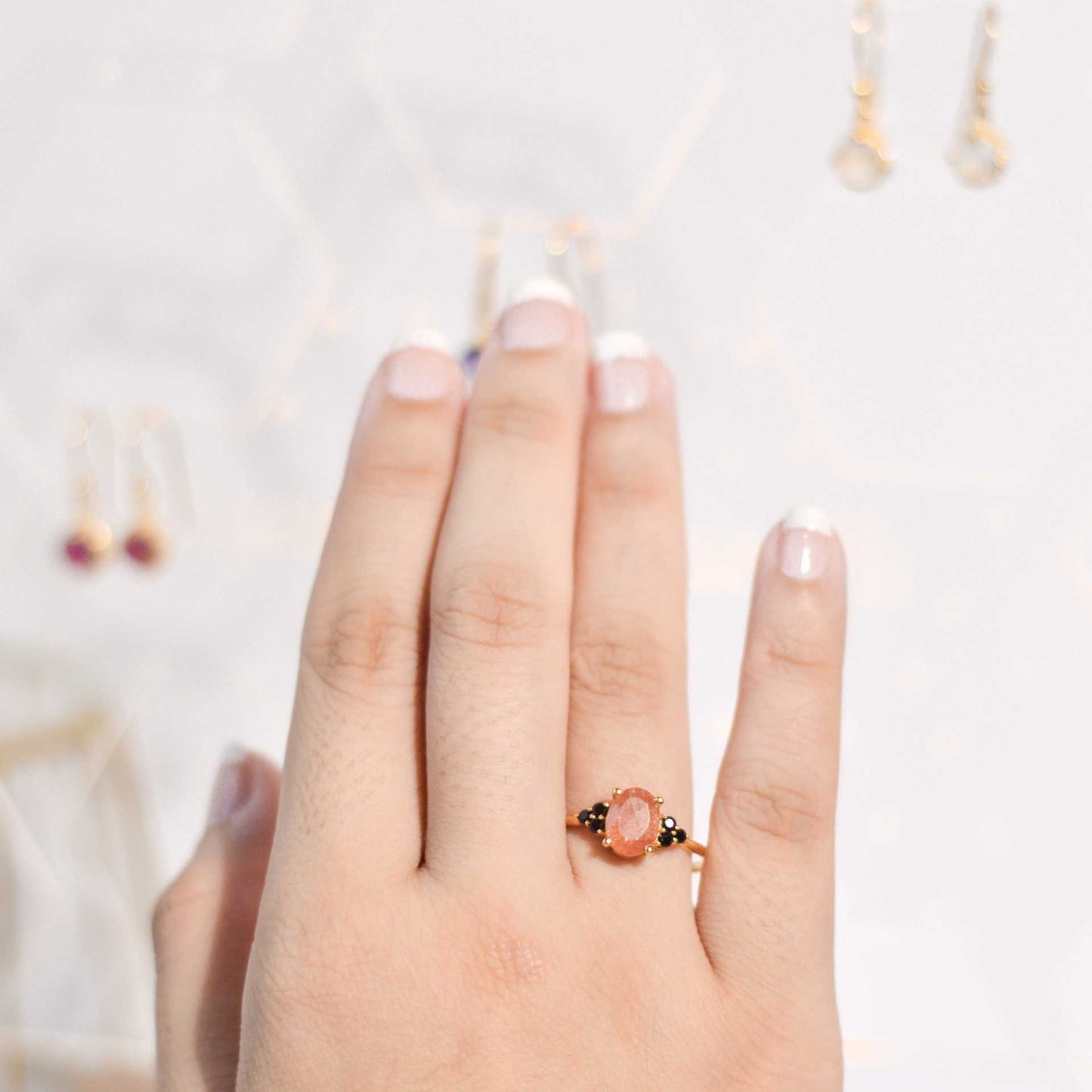 8 x 6 mm Oval cut Sunstone with 3 Black Spinel side stones Ring
