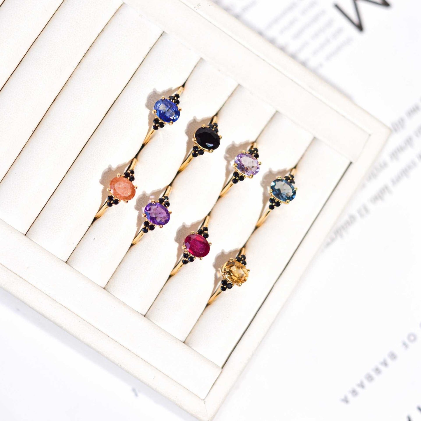 8 x 6 mm Oval cut London Blue Topaz with 3 Black Spinel side stones Ring