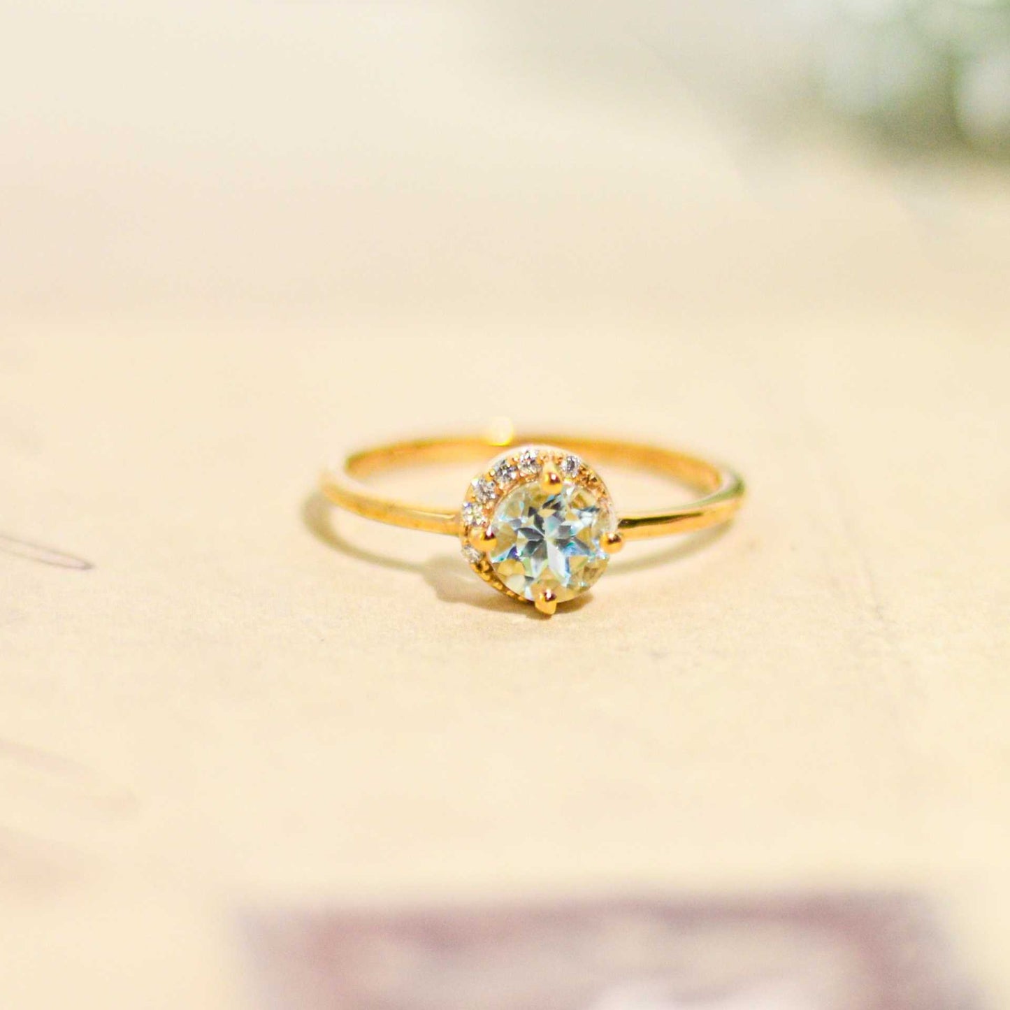 6 mm Round cut Swiss Blue Topaz with Crescent Cz Yellow gold plated Ring