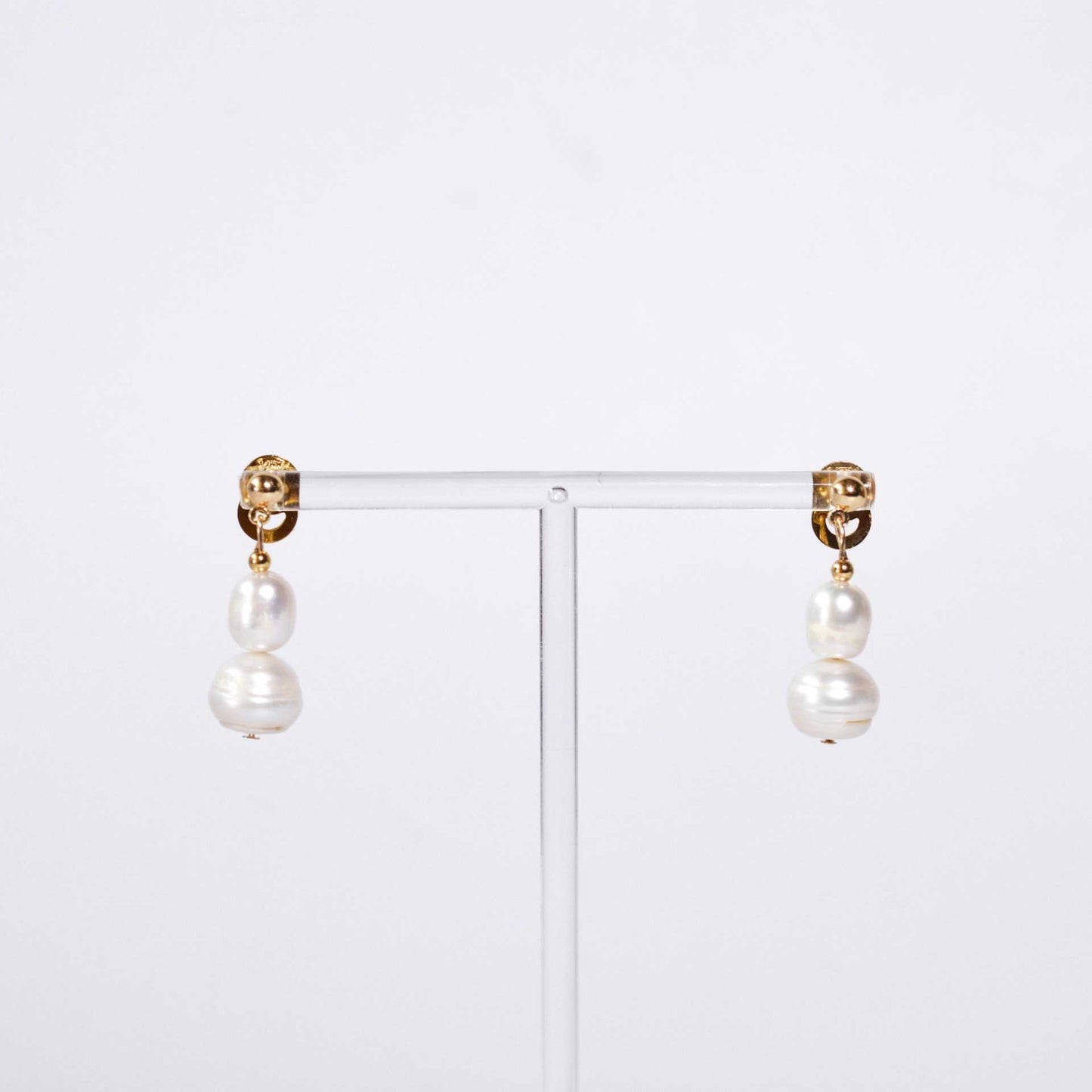 White oval and siopao dangling pearls yellow gold plated earrings