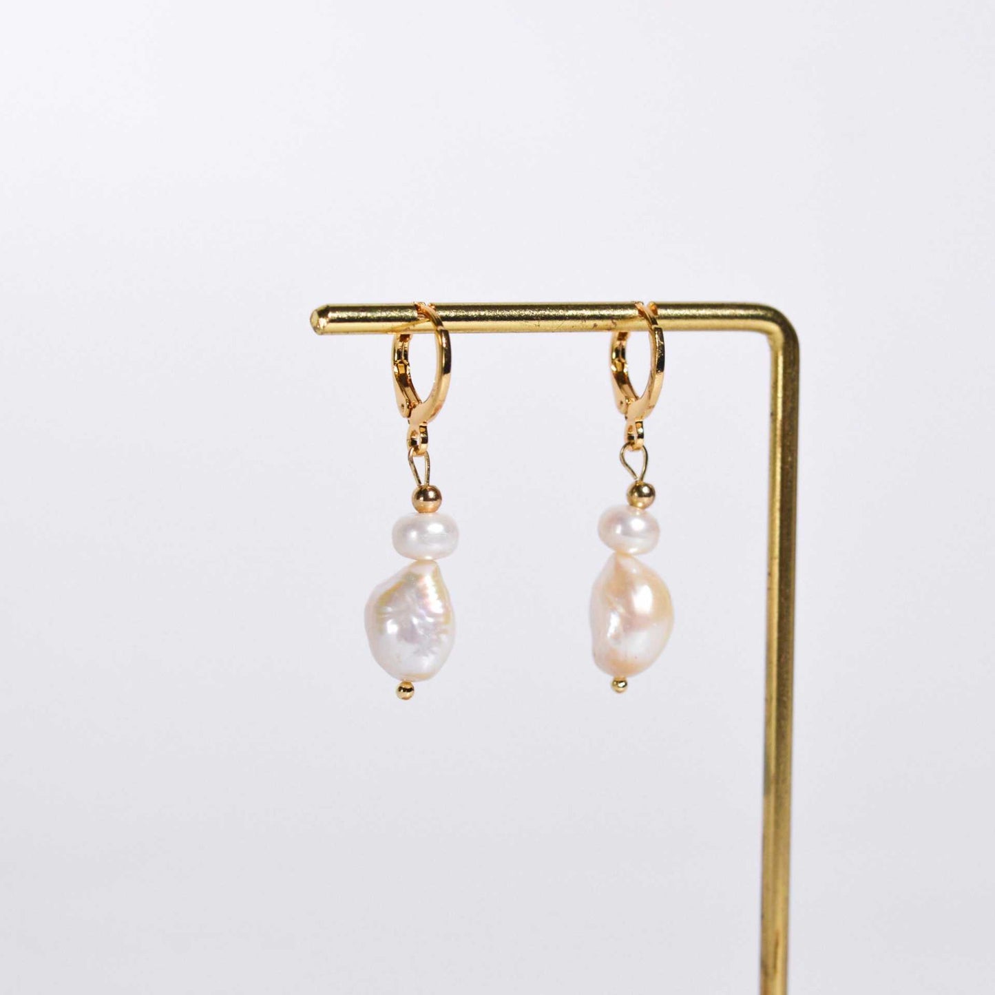 White siopao and baroque dangling pearls yellow gold plated earrings
