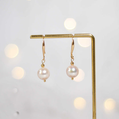 10.5 mm white round pearl yellow gold plated dangling earrings