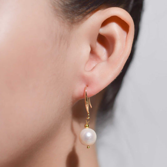 10.5 mm white round pearl yellow gold plated dangling earrings