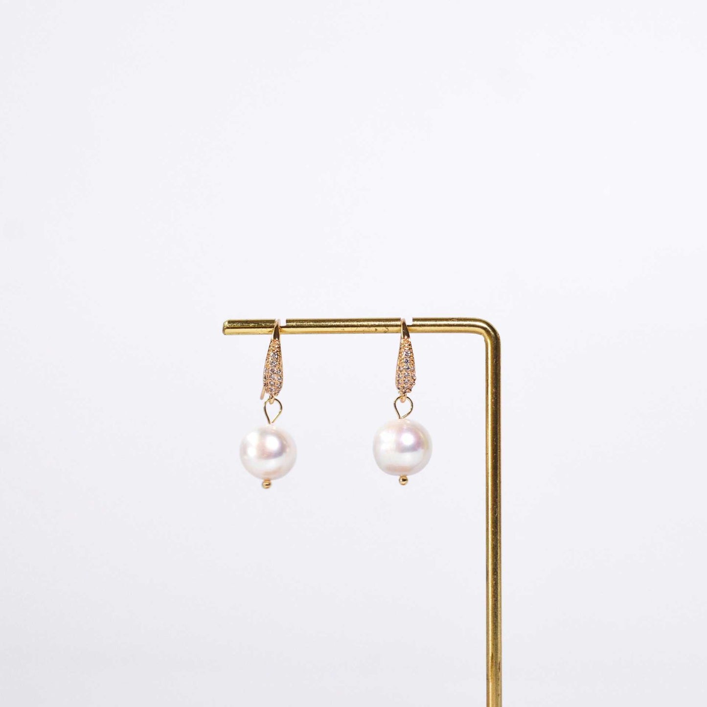 10.6 mm round pearl dangling yellow gold plated inlaid zircon earrings