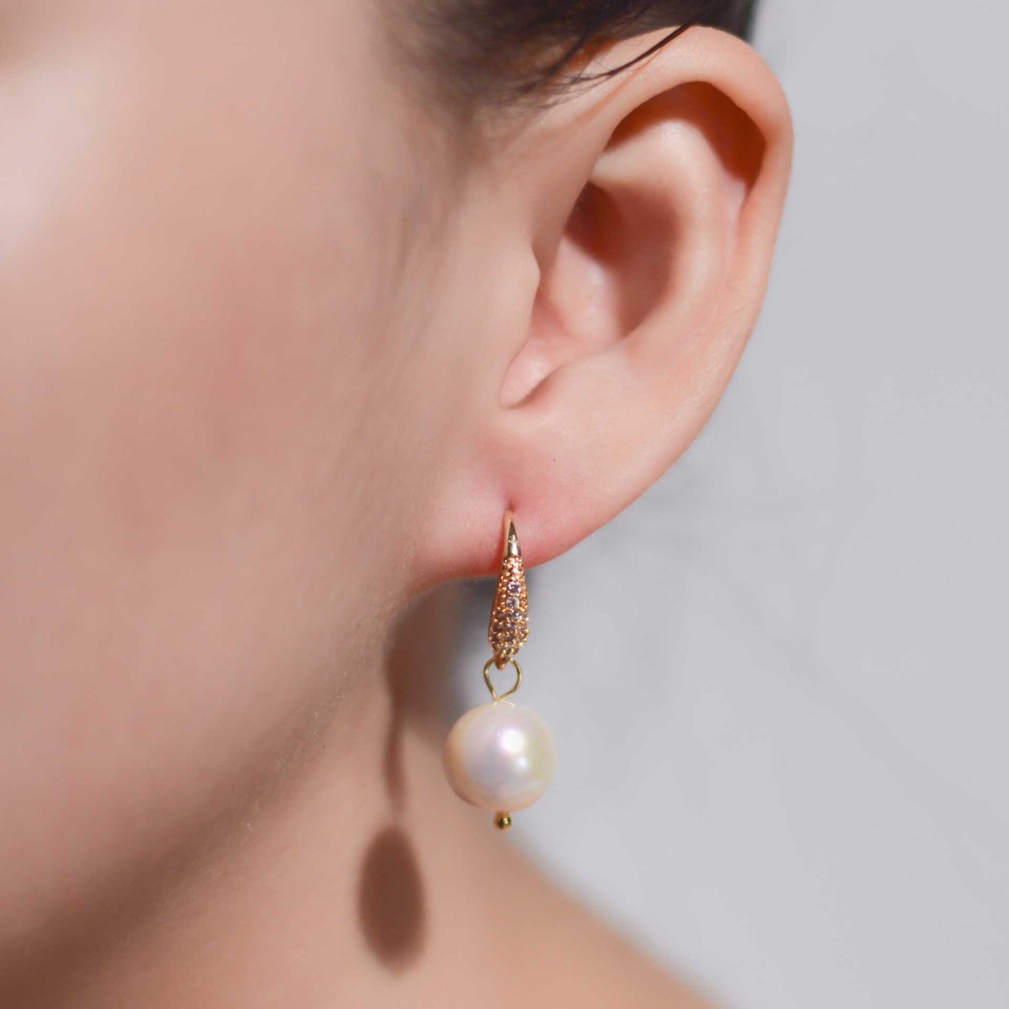 10.6 mm round pearl dangling yellow gold plated inlaid zircon earrings