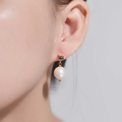 10.8 mm white round yellow gold plated dangling earrings with square stud