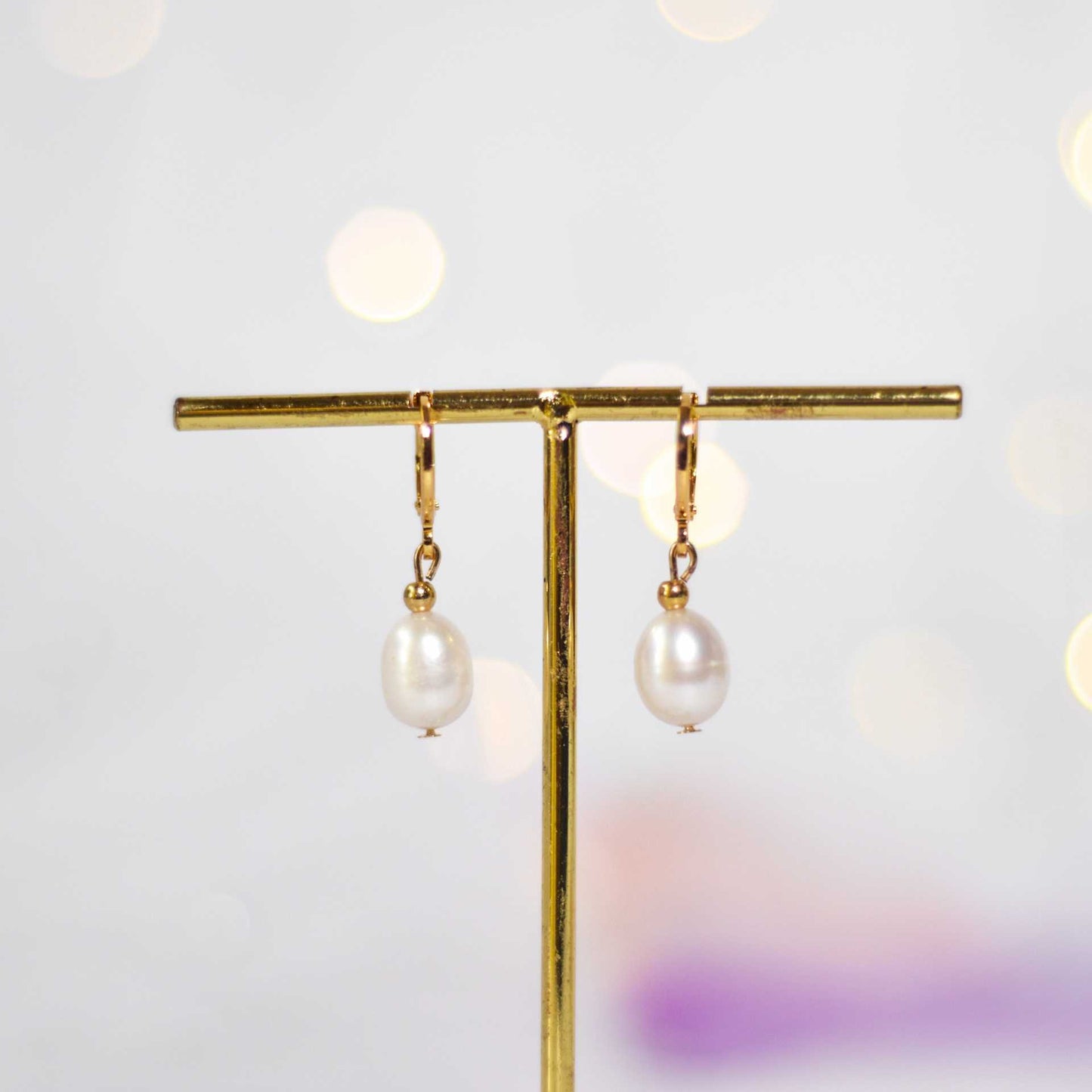 11 mm white oval dangling pearls yellow gold plated earrings