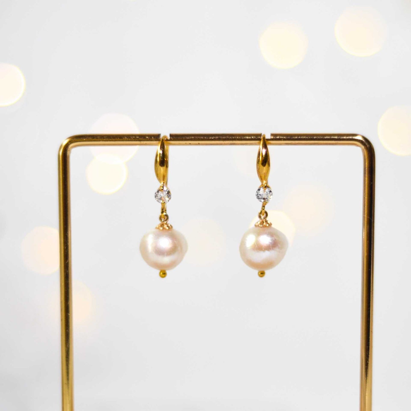 11 mm white kieshe pearl dangling yellow gold plated with zircon earrings
