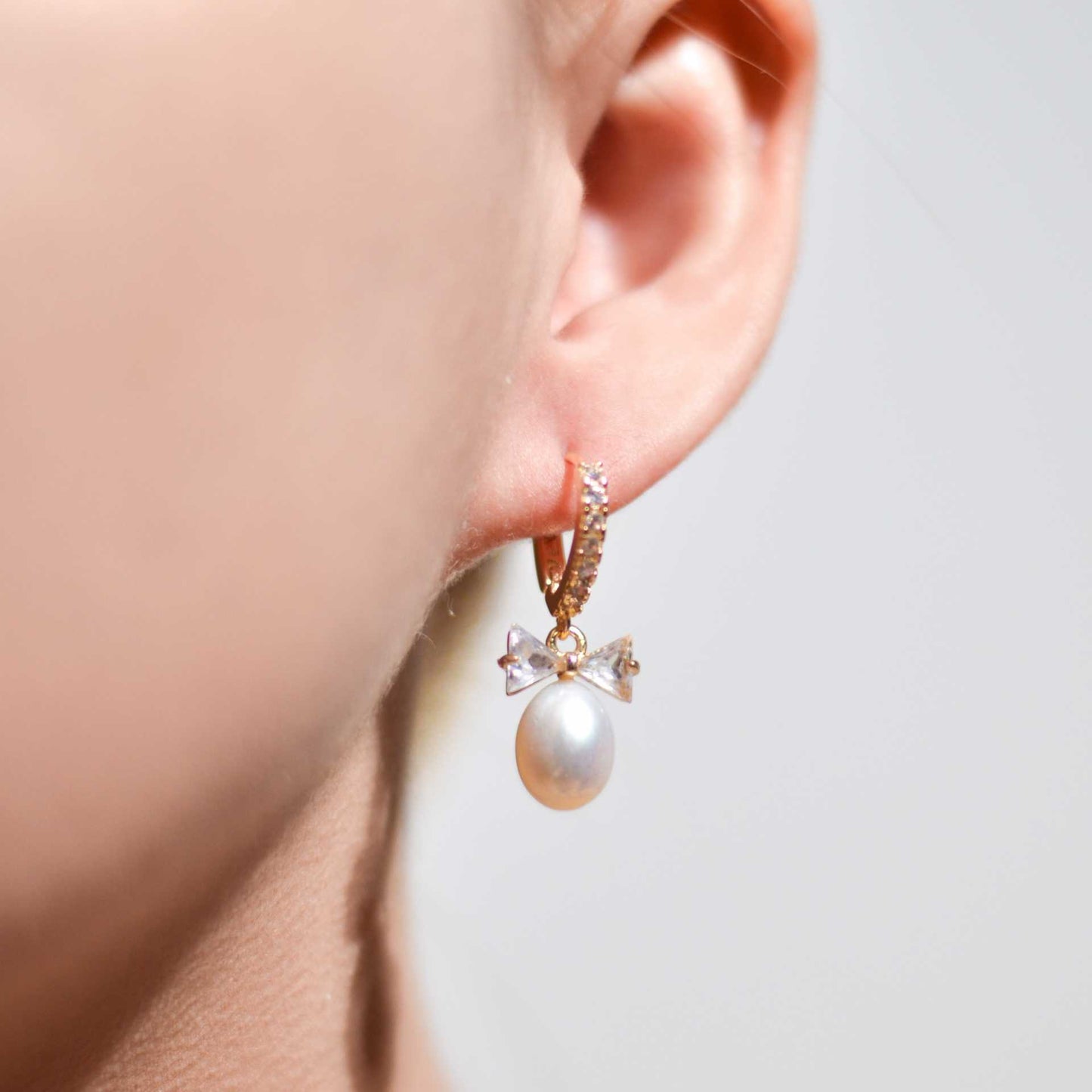 12 mm White Biwa Pearl Yellow Gold Plated Zircon Inlaid Dangling with Zircon Bow Earrings