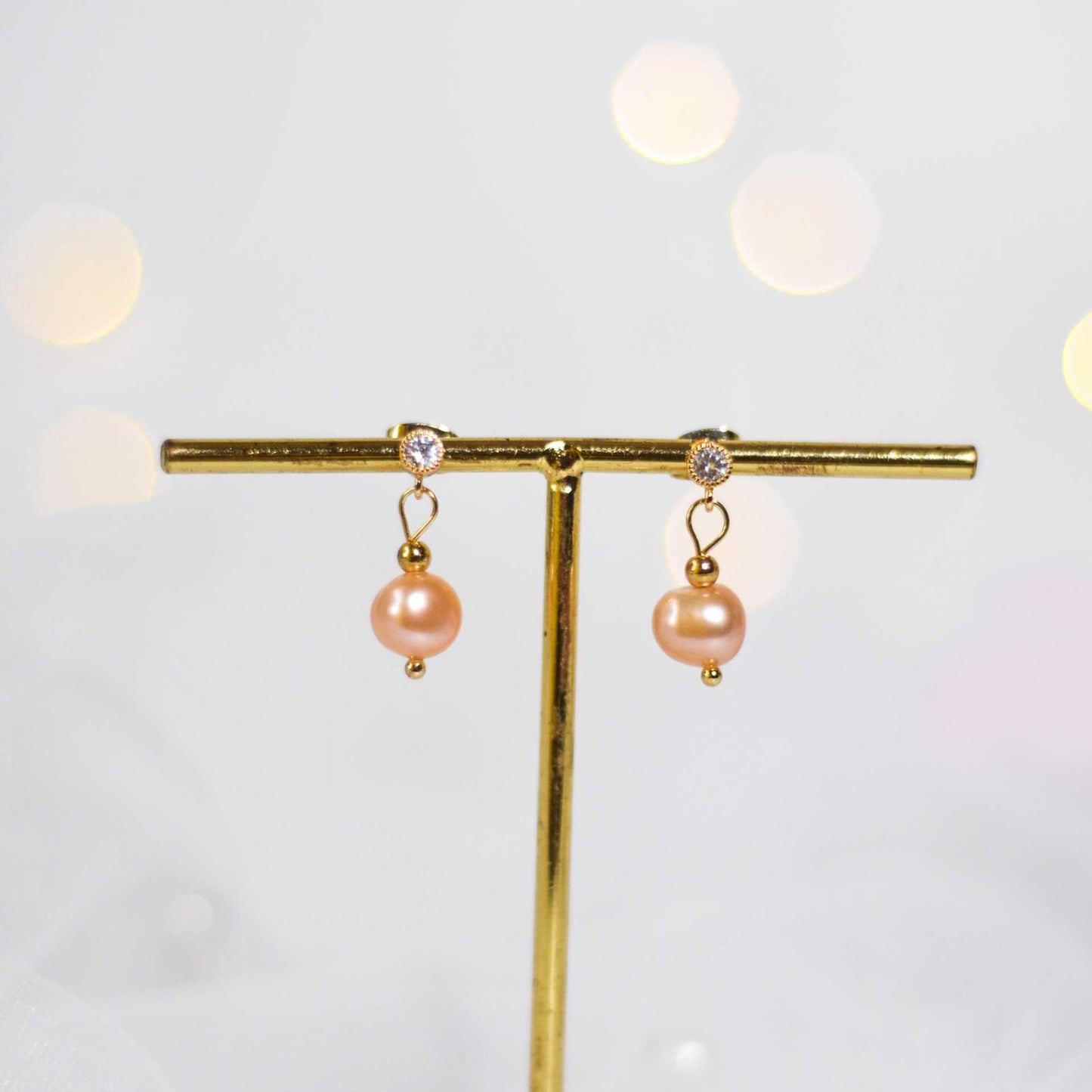 8.1 mm peach semi-round pearl yellow gold plated dangling with 4 mm zircon stud earrings