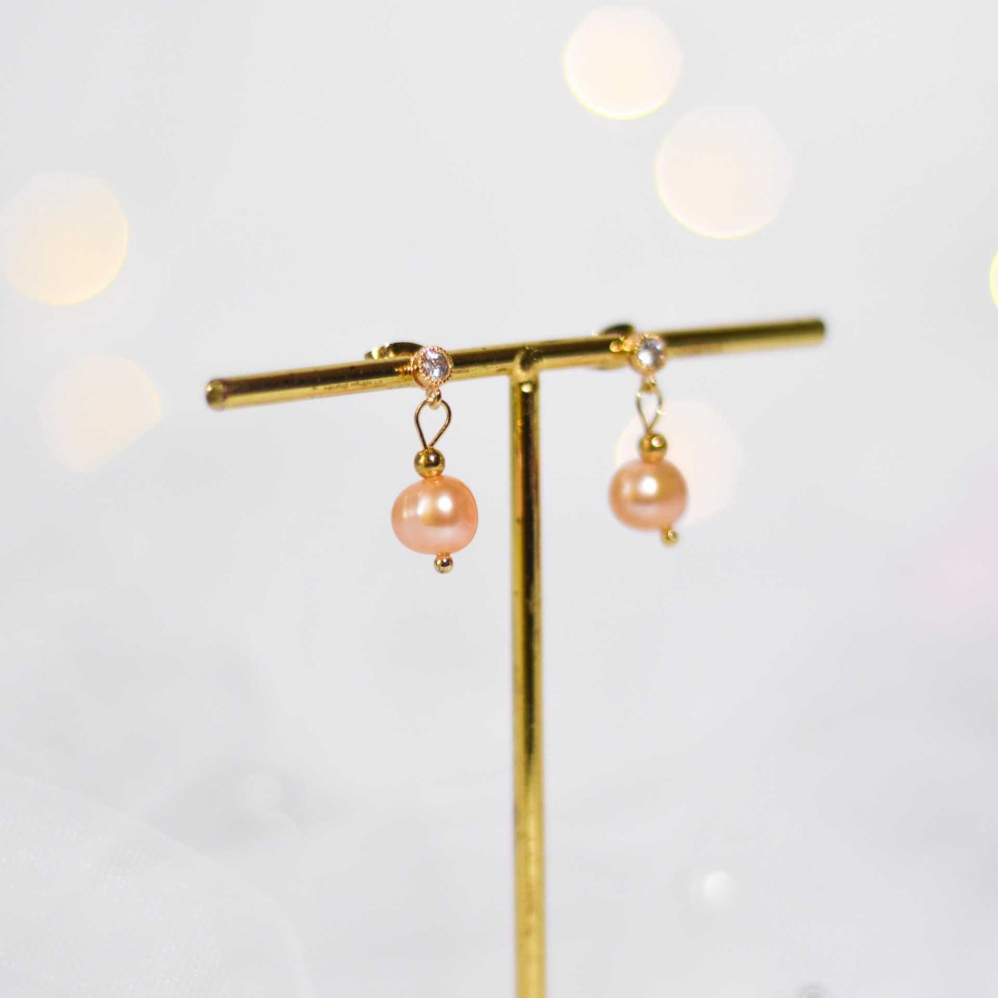 8.1 mm peach semi-round pearl yellow gold plated dangling with 4 mm zircon stud earrings