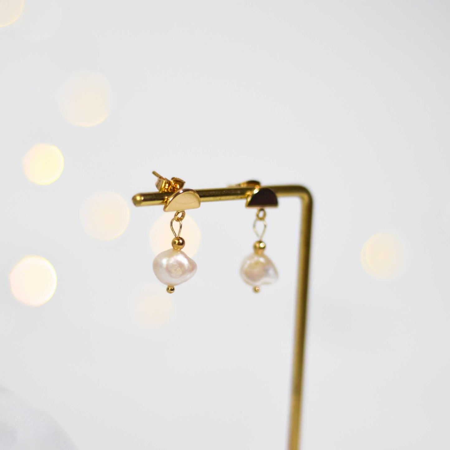 8.2 mm white kieshe pearl dangling yellow gold plated with half circle stud earrings