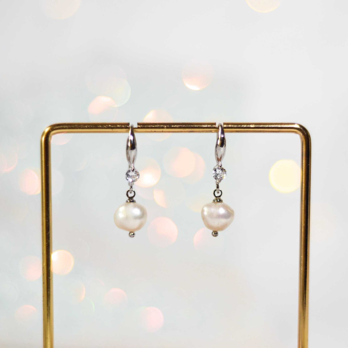 8.3 mm white kieshe pearl dangling rhodium plated with zircon earrings