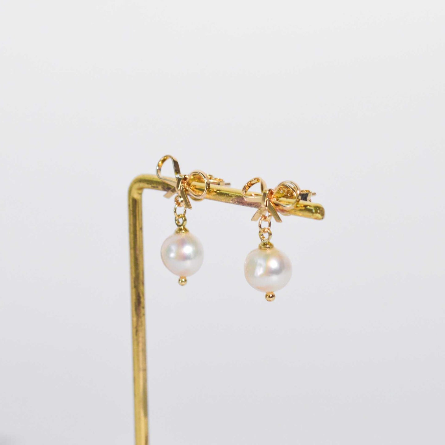 8.5 mm White Kieshe Pearl Yellow Gold Plated with Bow Stud Earrings