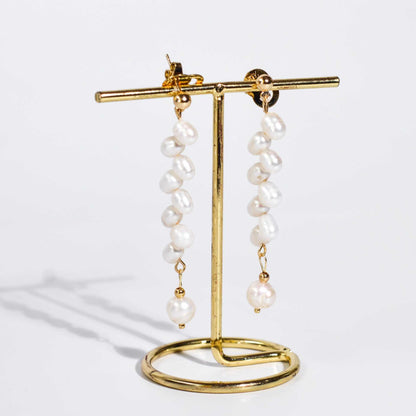 8 pcs. White dancing pearls with 7.8 mm semi-round pearl yellow gold plated dangling earrings
