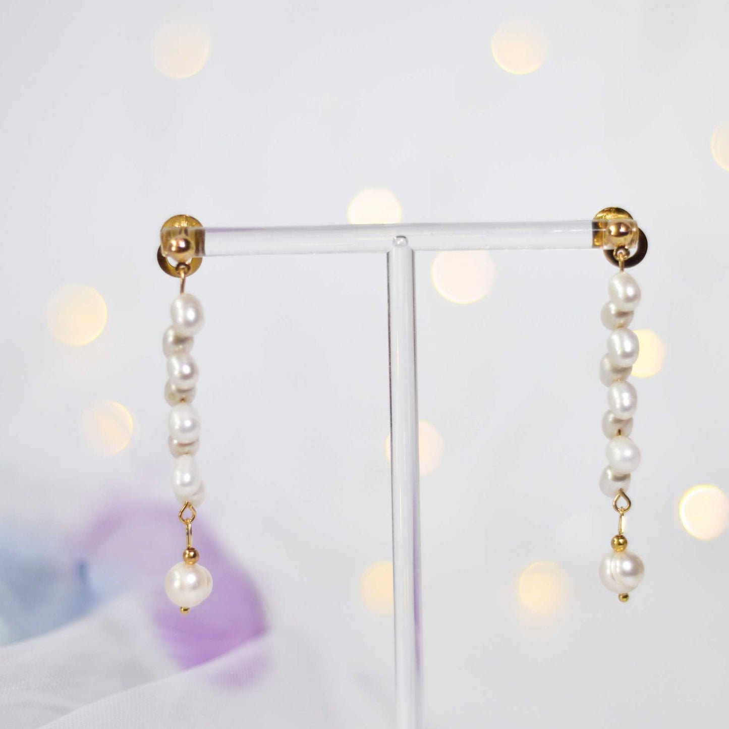 8 pcs. White dancing pearls with 7.8 mm semi-round pearl yellow gold plated dangling earrings