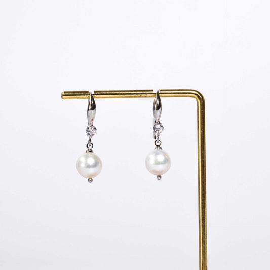 9.5 mm white semi-round pearl dangling rhodium plated with zircon earrings
