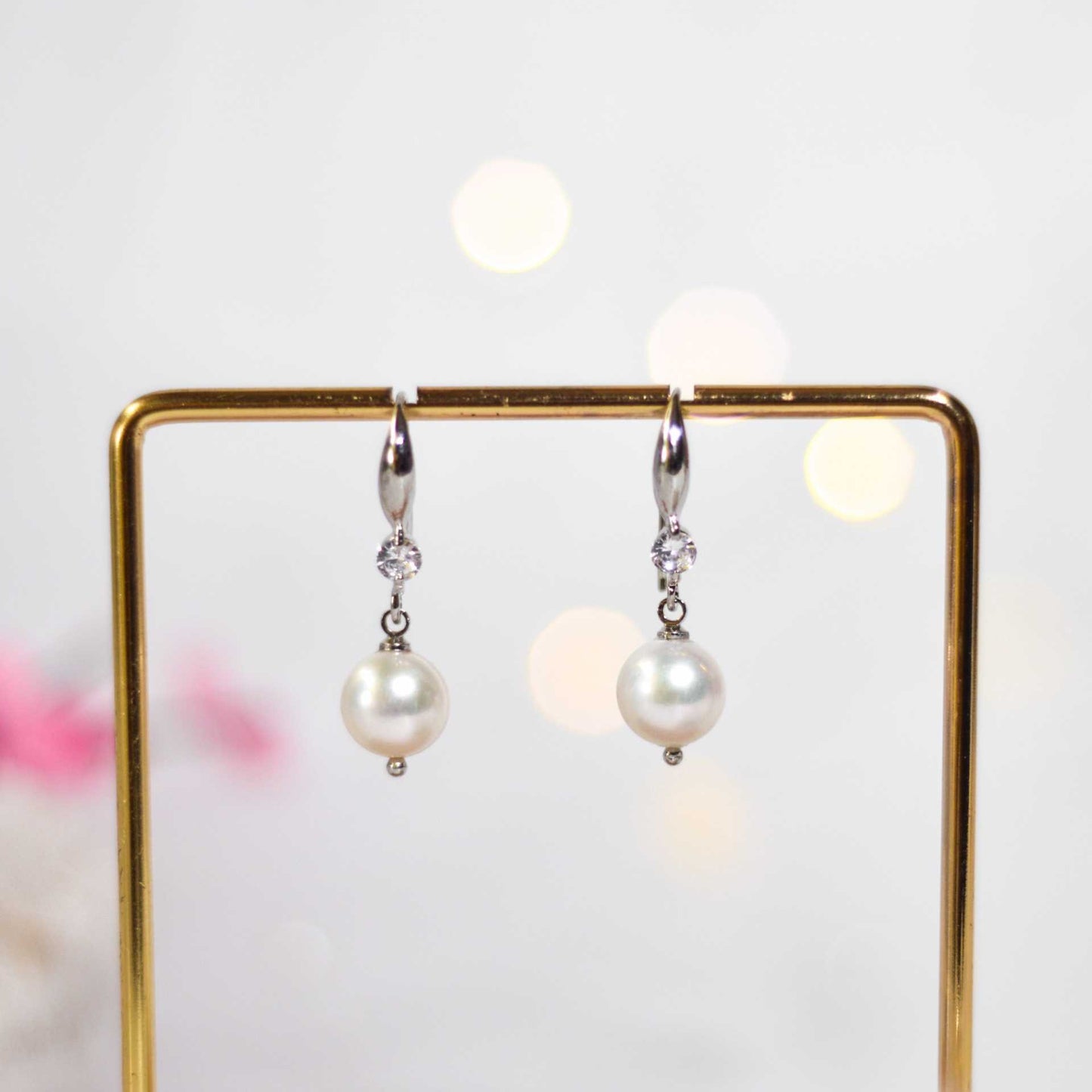 9.5 mm white semi-round pearl dangling rhodium plated with zircon earrings