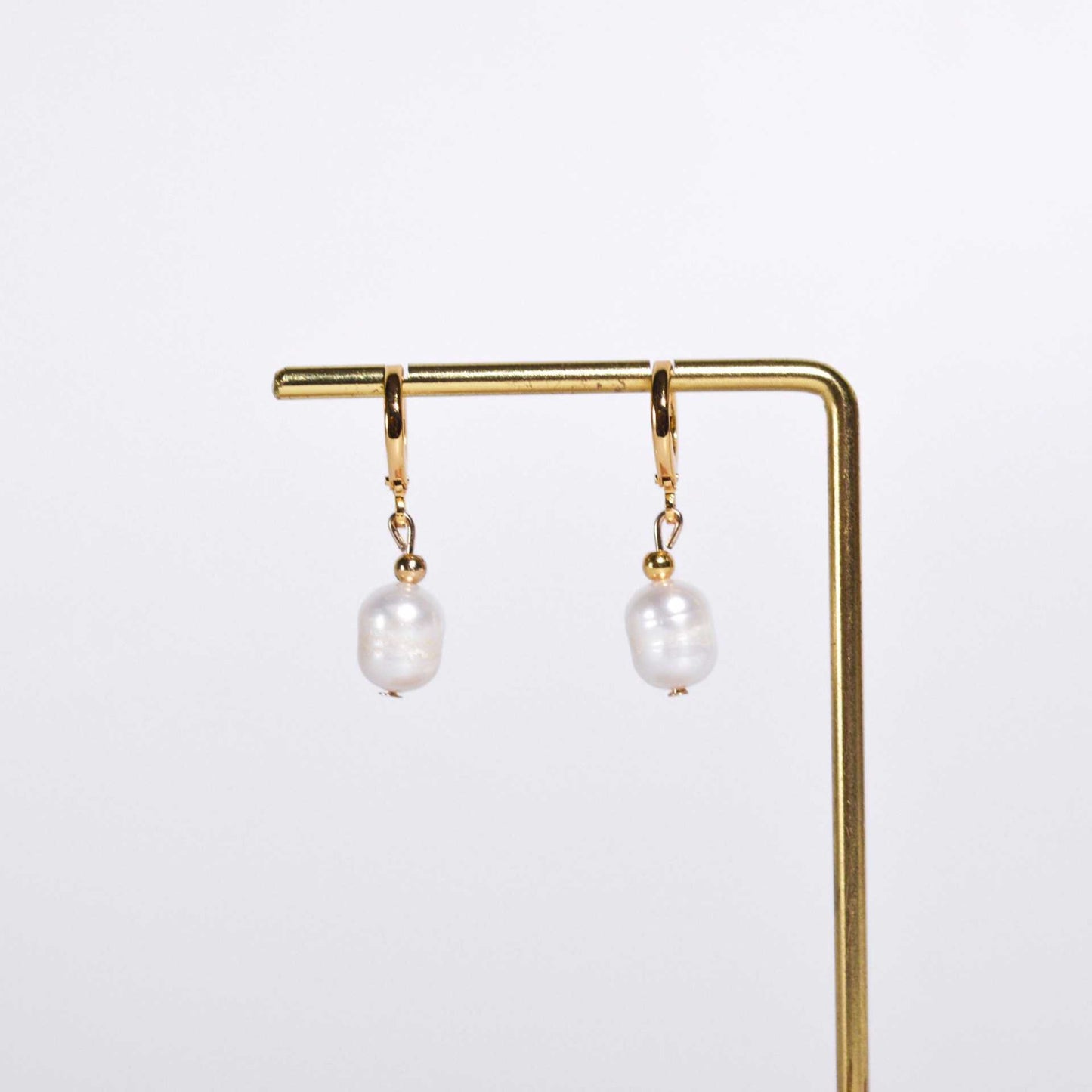 9.8 mm white oval dangling yellow gold plated earrings