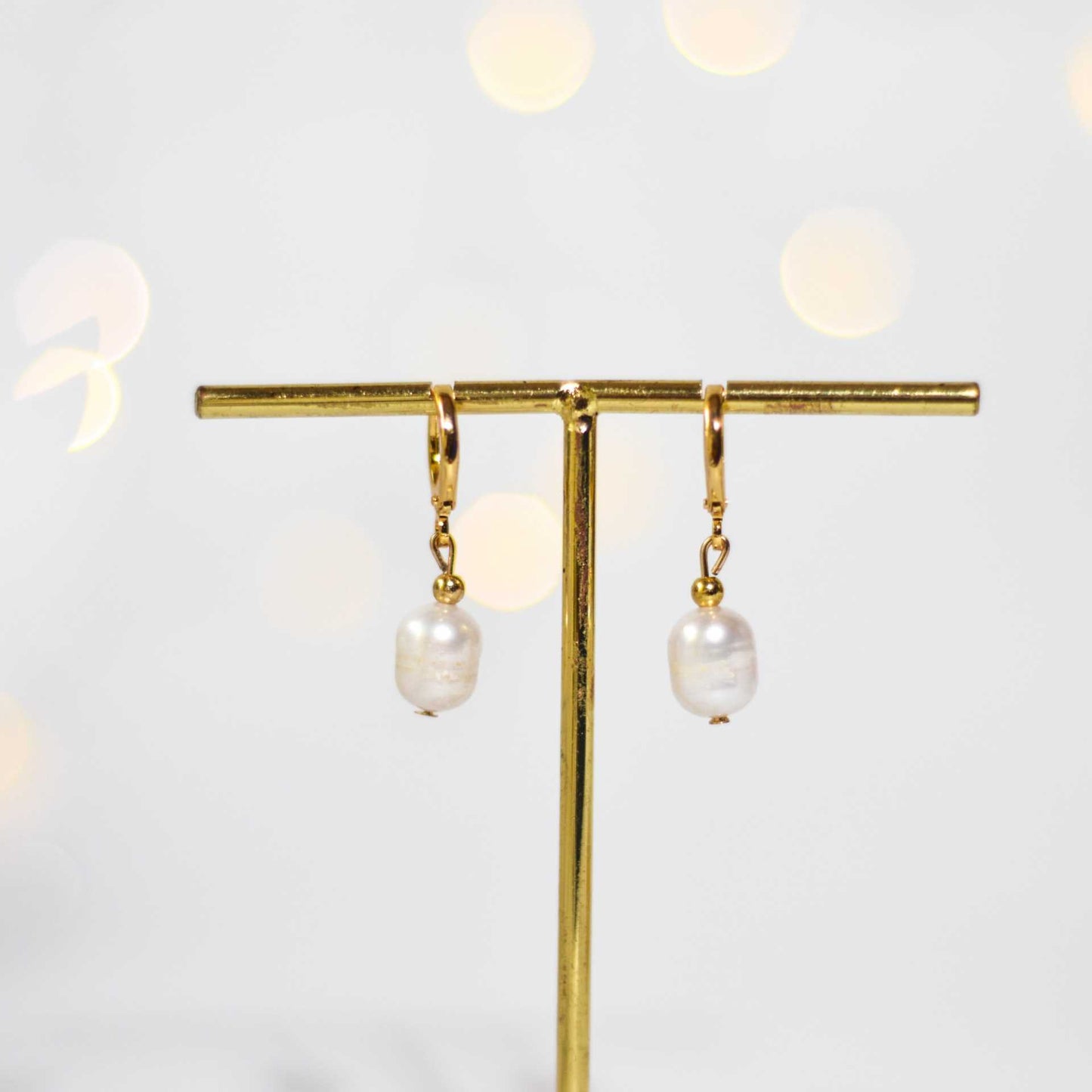 9.8 mm white oval dangling yellow gold plated earrings