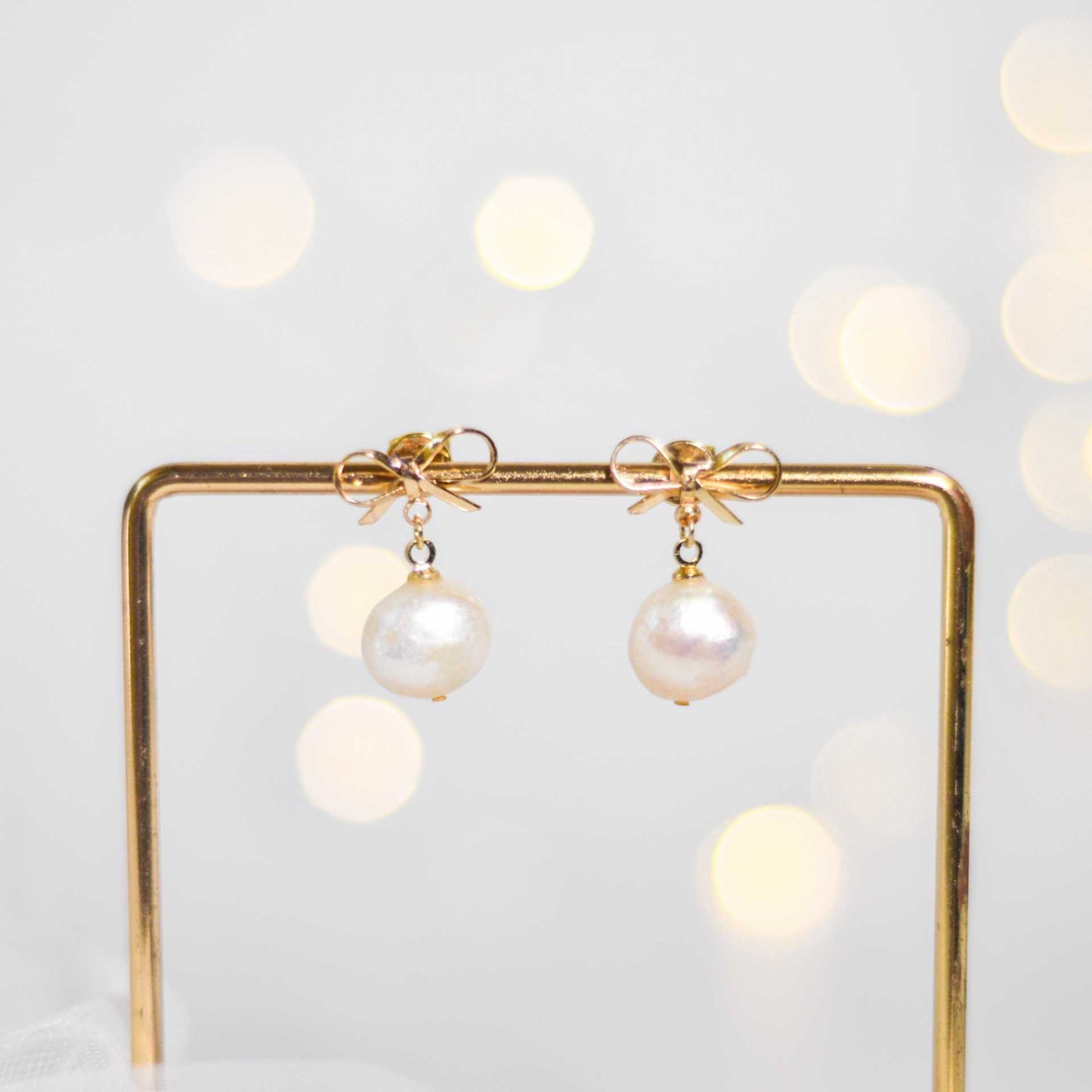 10.8 mm White Kieshe Pearl Yellow Gold Plated with Bow Stud Earrings