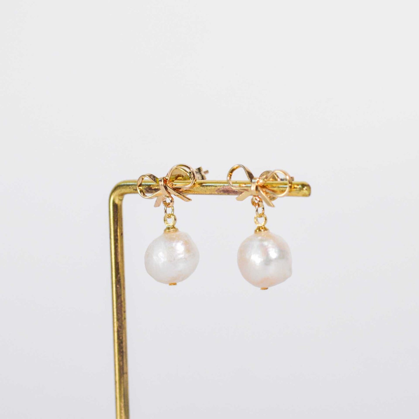 10.8 mm White Kieshe Pearl Yellow Gold Plated with Bow Stud Earrings