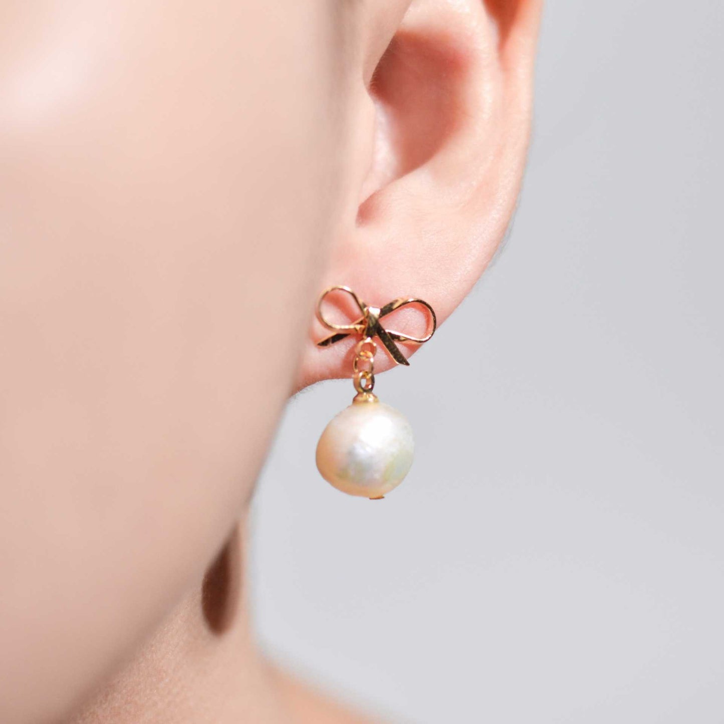 10.8 mm White Kieshe Pearl Yellow Gold Plated with Bow Stud Earrings