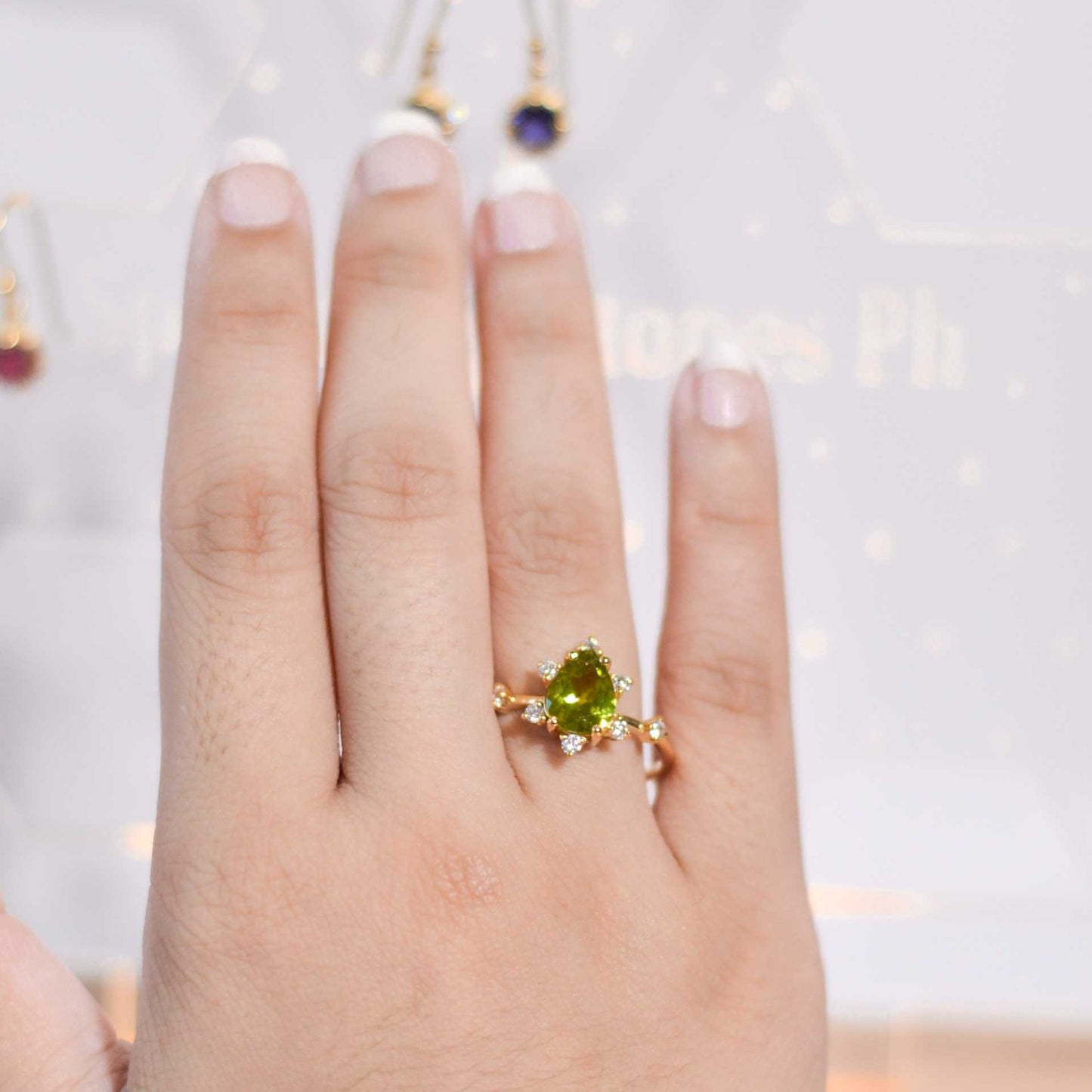 8 x 6 mm Pear cut Peridot Sunburst Ring