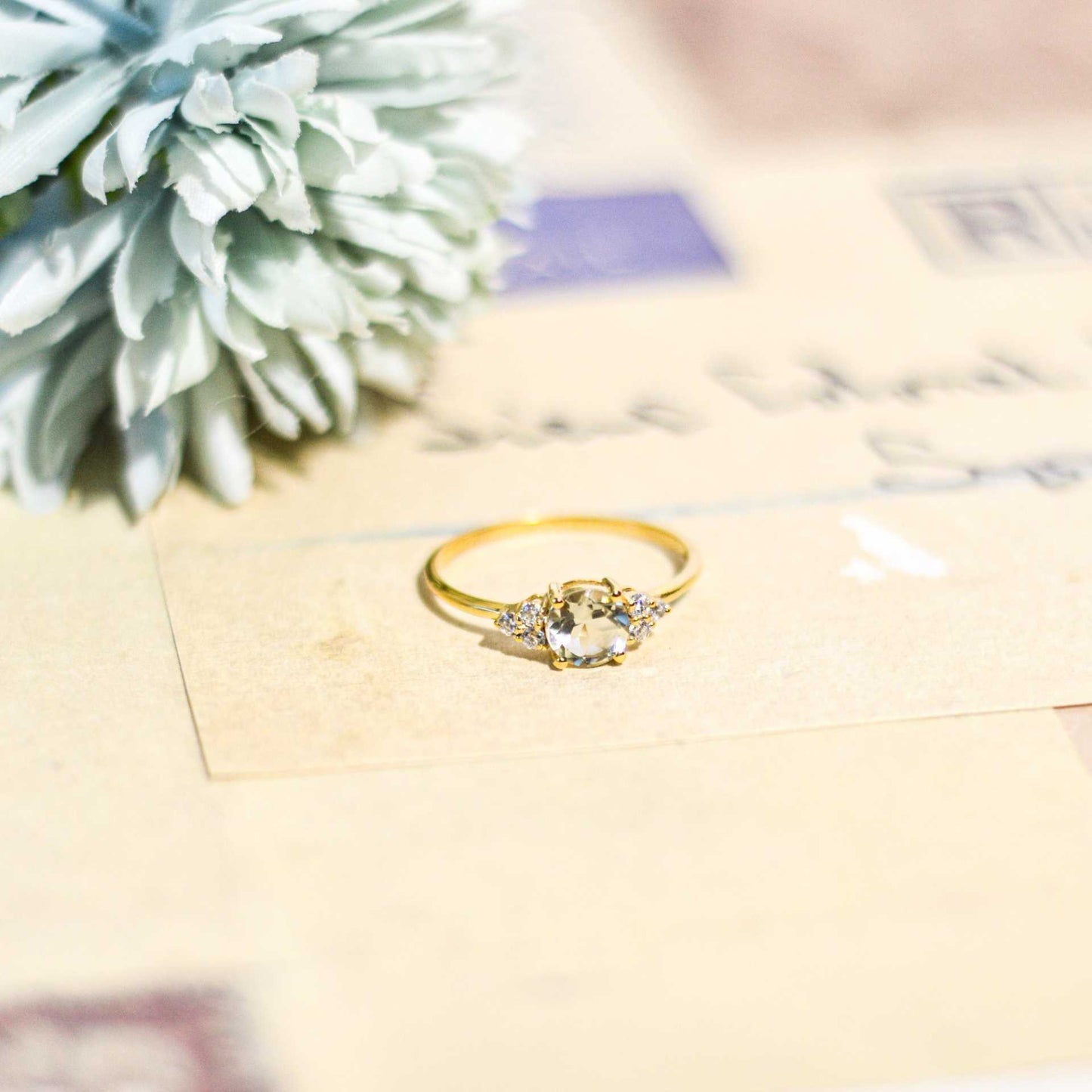 6 mm Round cut White Topaz with 3 Cz side stones Ring