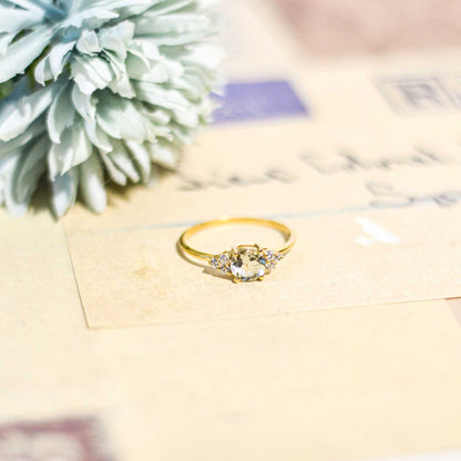 6 mm Round cut White Topaz with 3 Cz side stones Ring