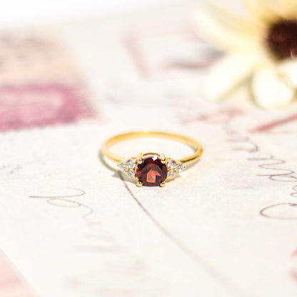 6 mm Round cut Red Garnet with 3 Cz side stones Ring