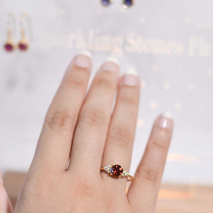 6 mm Round cut Red Garnet with 3 Cz side stones Ring