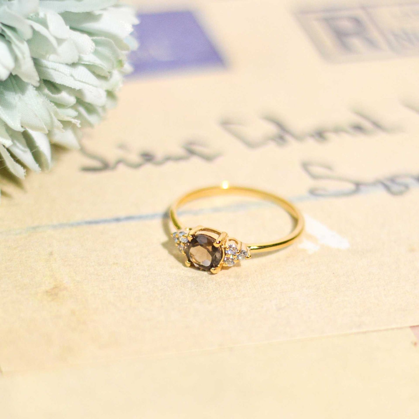 6 mm Round cut Smokey Topaz with 3 Cz side stones Ring