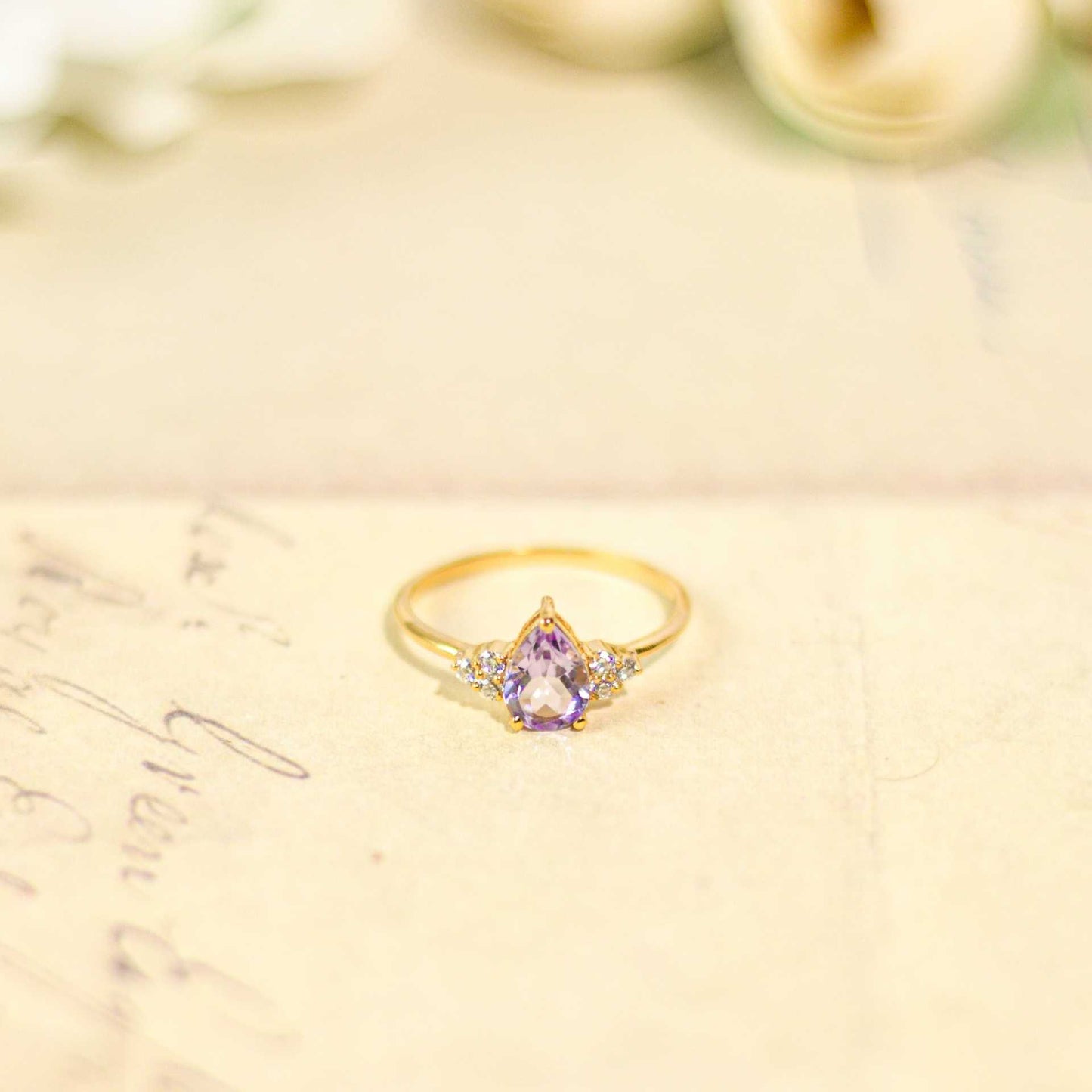 8 x 6 mm Pear cut Pink Amethyst with 3 Cz side stones Ring
