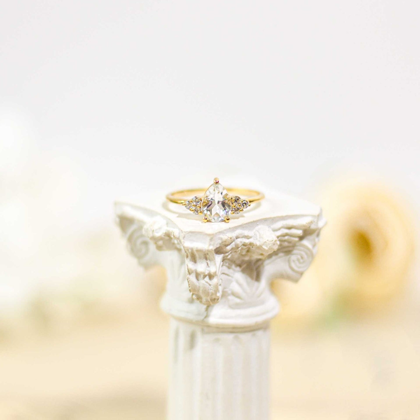 8 x 6 mm Pear cut White Topaz with 3 Cz side stones Ring