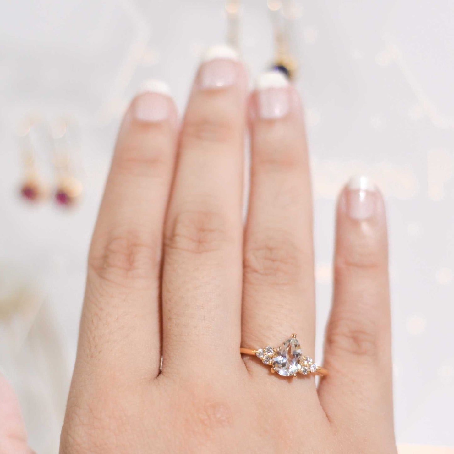 8 x 6 mm Pear cut White Topaz with 3 Cz side stones Ring
