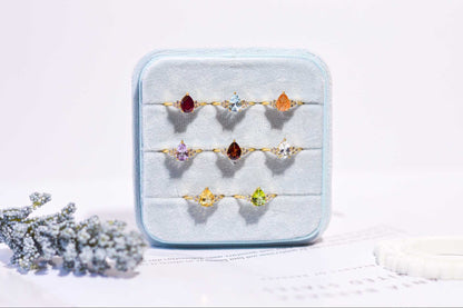 8 x 6 mm Pear cut White Topaz with 3 Cz side stones Ring