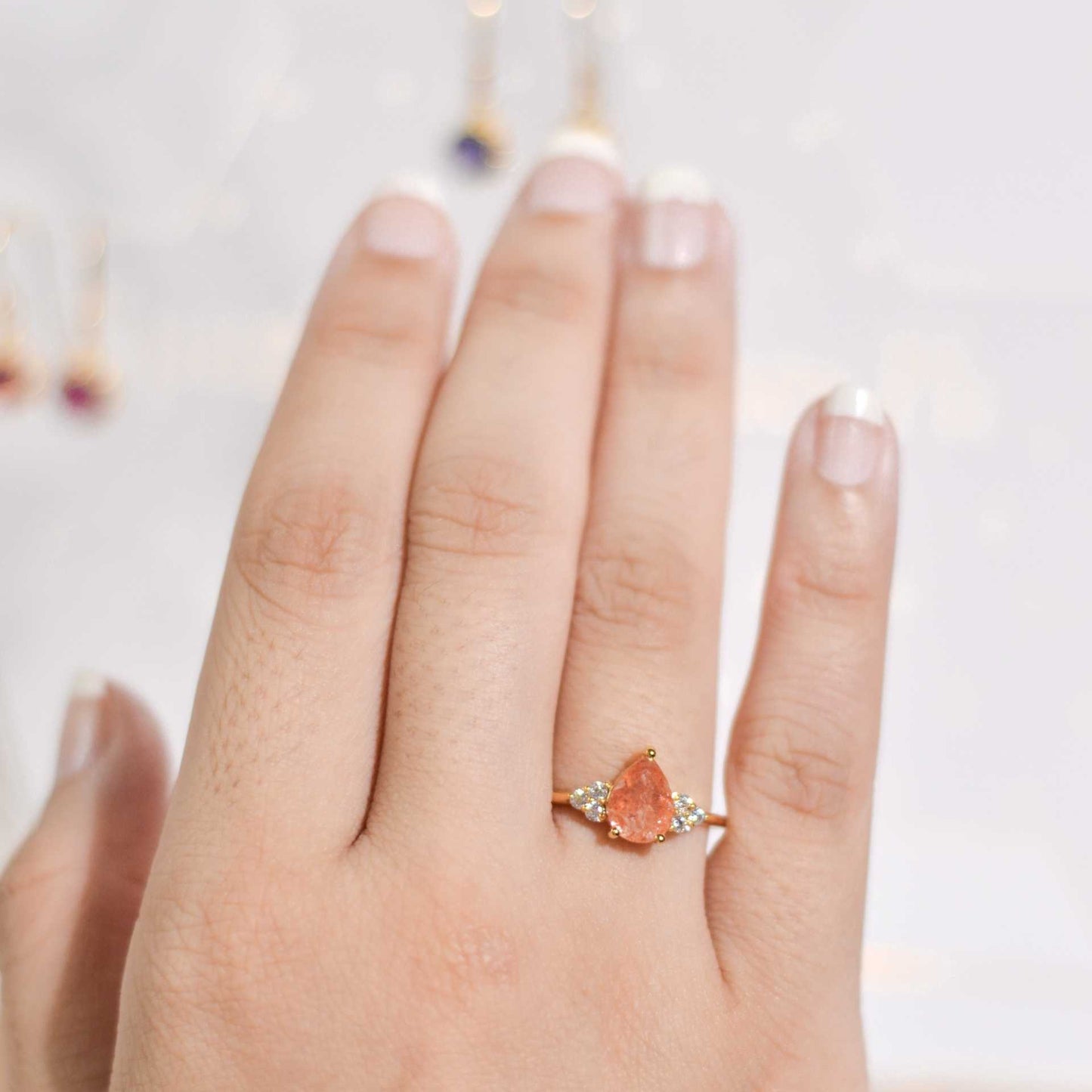 8 x 6 mm Pear cut Sunstone with 3 Cz side stones Ring