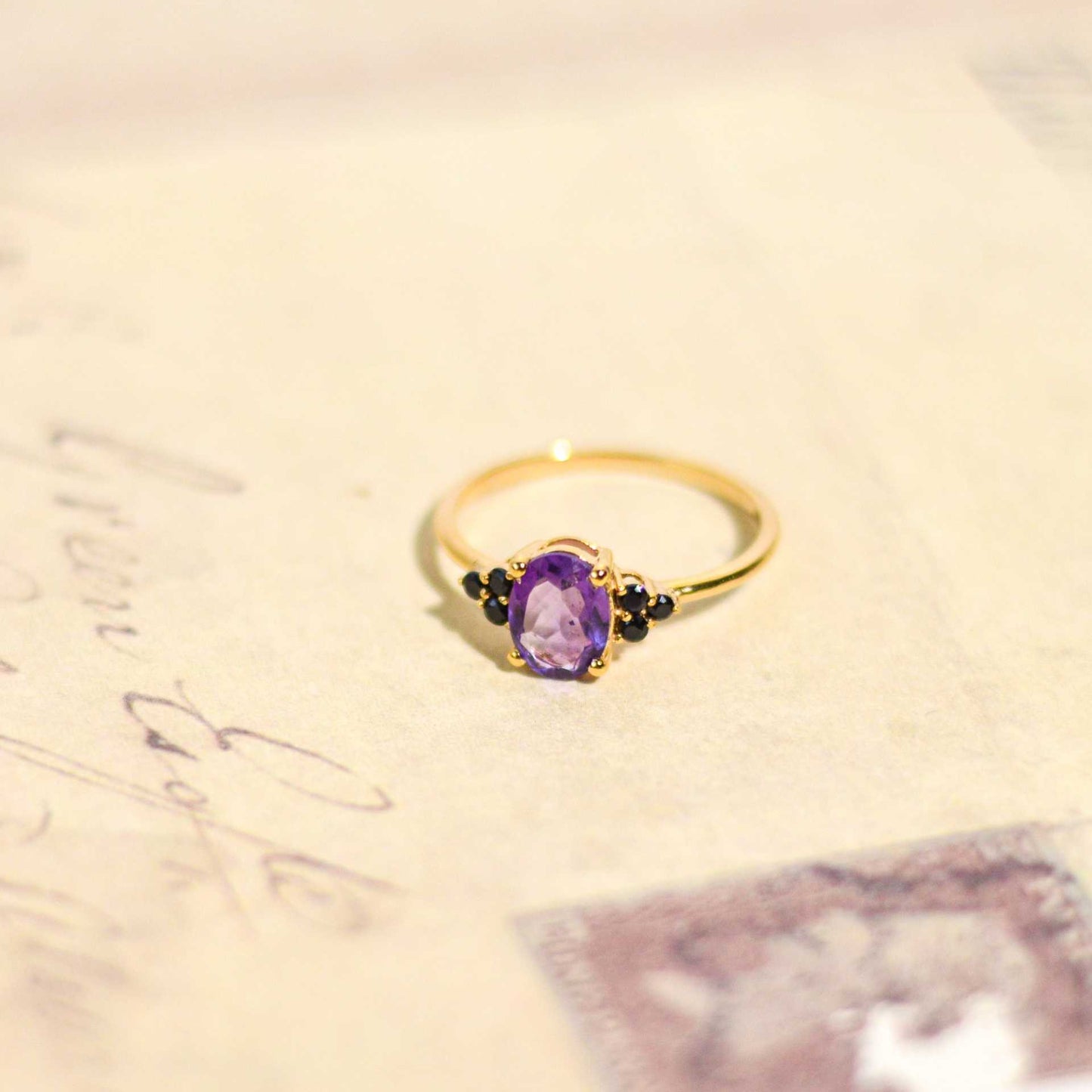 8 x 6 mm Oval cut Purple Amethyst with 3 Black Spinel side stones Ring