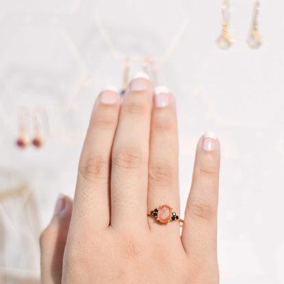 8 x 6 mm Oval cut Sunstone with 3 Black Spinel side stones Ring