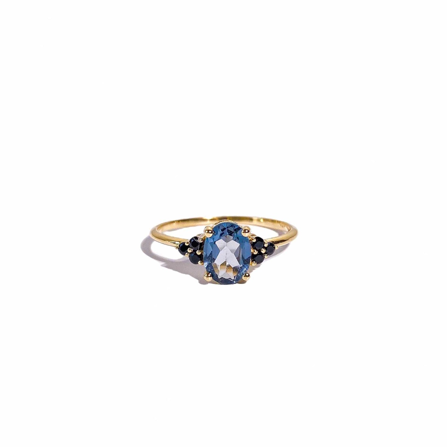 8 x 6 mm Oval cut London Blue Topaz with 3 Black Spinel side stones Ring