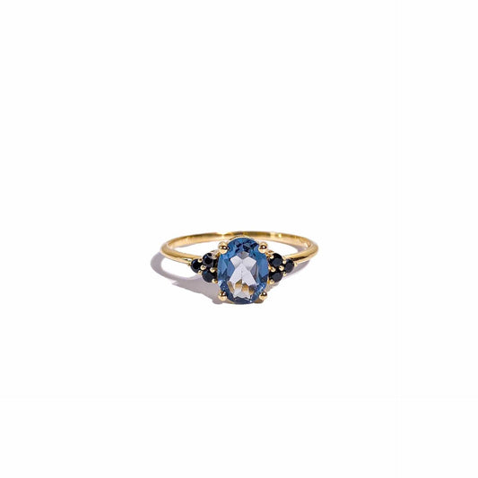 8 x 6 mm Oval cut London Blue Topaz with 3 Black Spinel side stones Ring