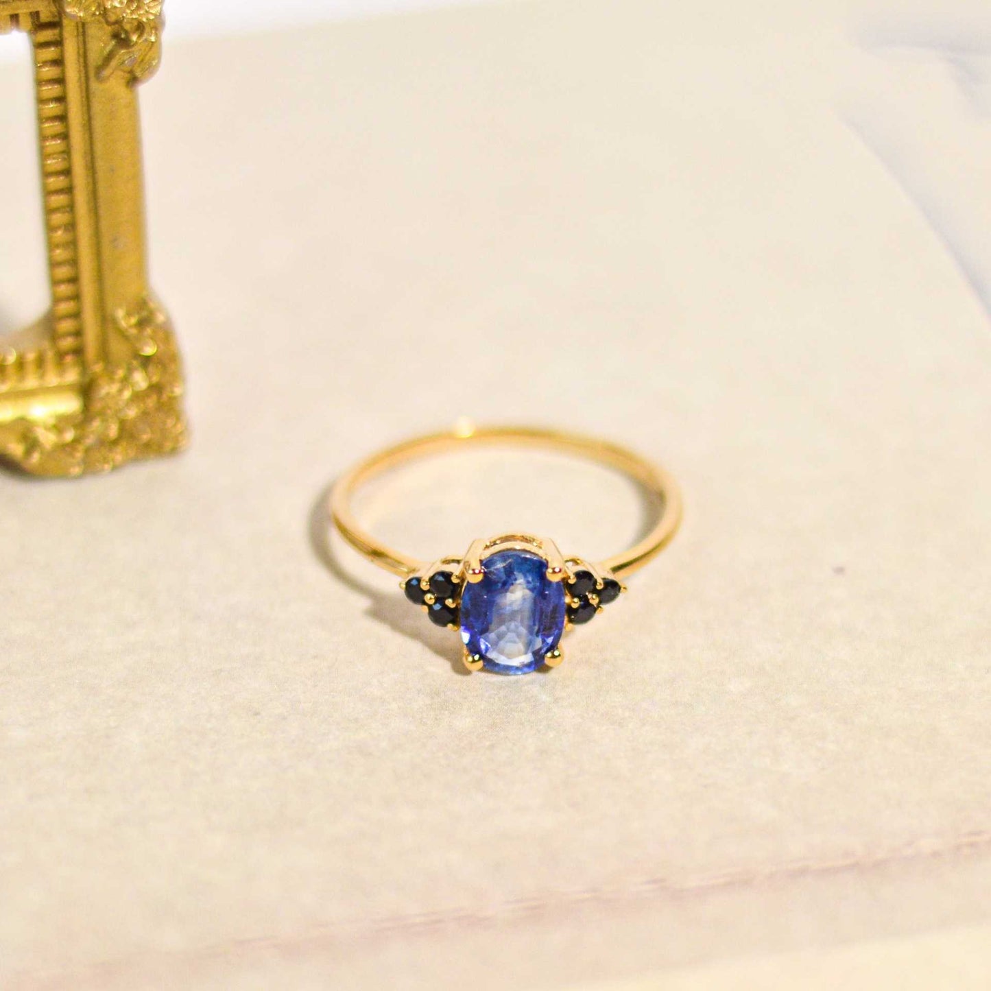 8 x 6 mm Oval cut Kyanite with 3 Black Spinel side stones Ring