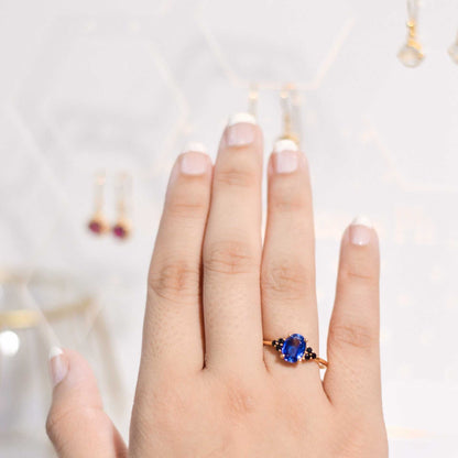 8 x 6 mm Oval cut Kyanite with 3 Black Spinel side stones Ring