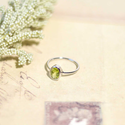 8 x 6 mm Oval cut Peridot Bezel Ring