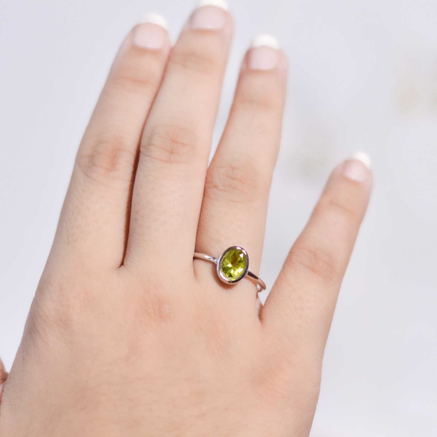 8 x 6 mm Oval cut Peridot Bezel Ring