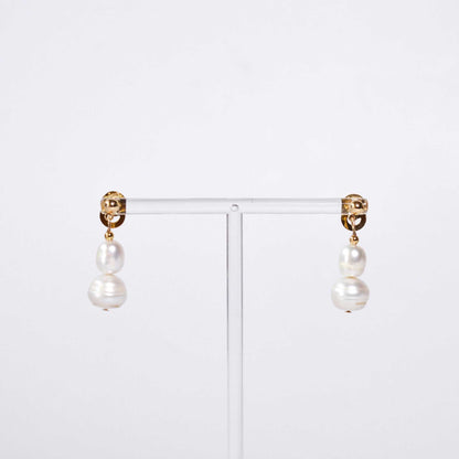 White oval and siopao dangling pearls yellow gold plated earrings